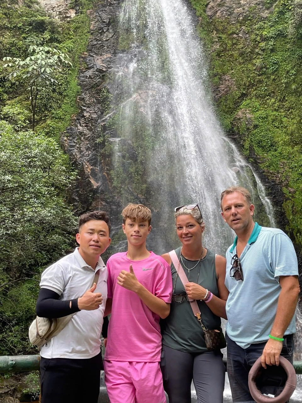 A powerful waterfall surrounded by forest near O Quy Ho Pass