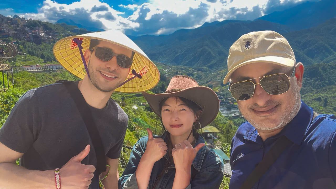 Chu with two guests in the green mountains around Sa Pa