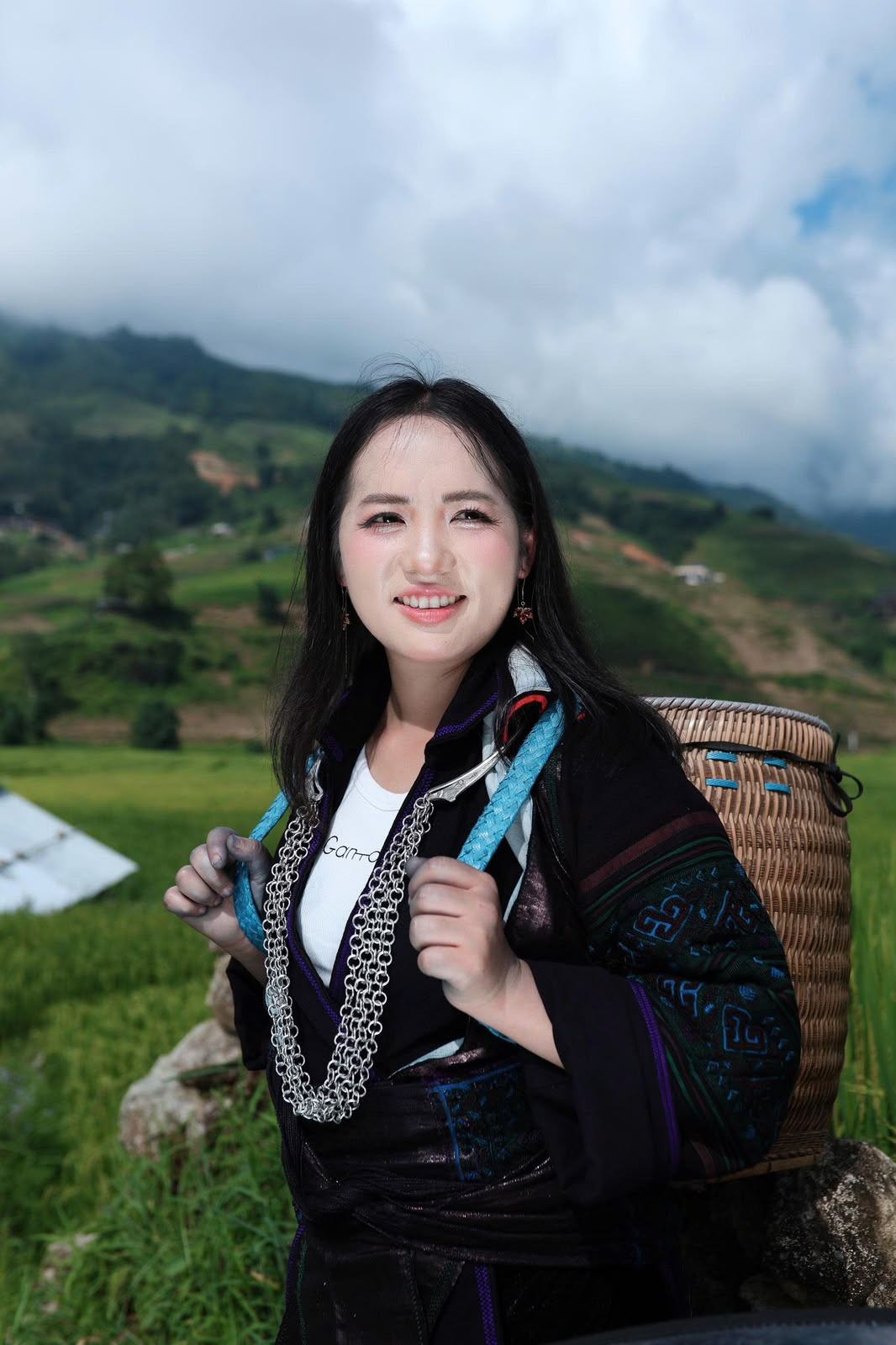 So wearing traditional clothing with a woven basket in the rice fields