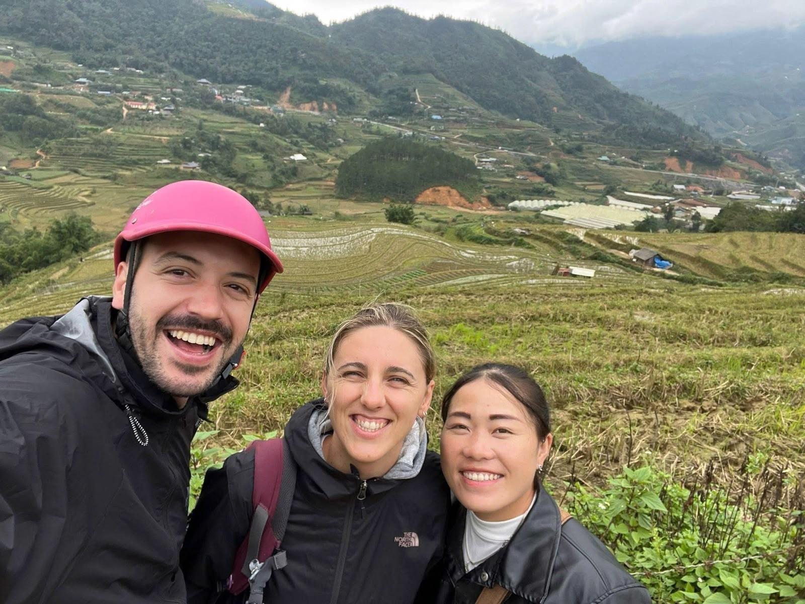 Guests beside terraced rice fields during a motorbike tour