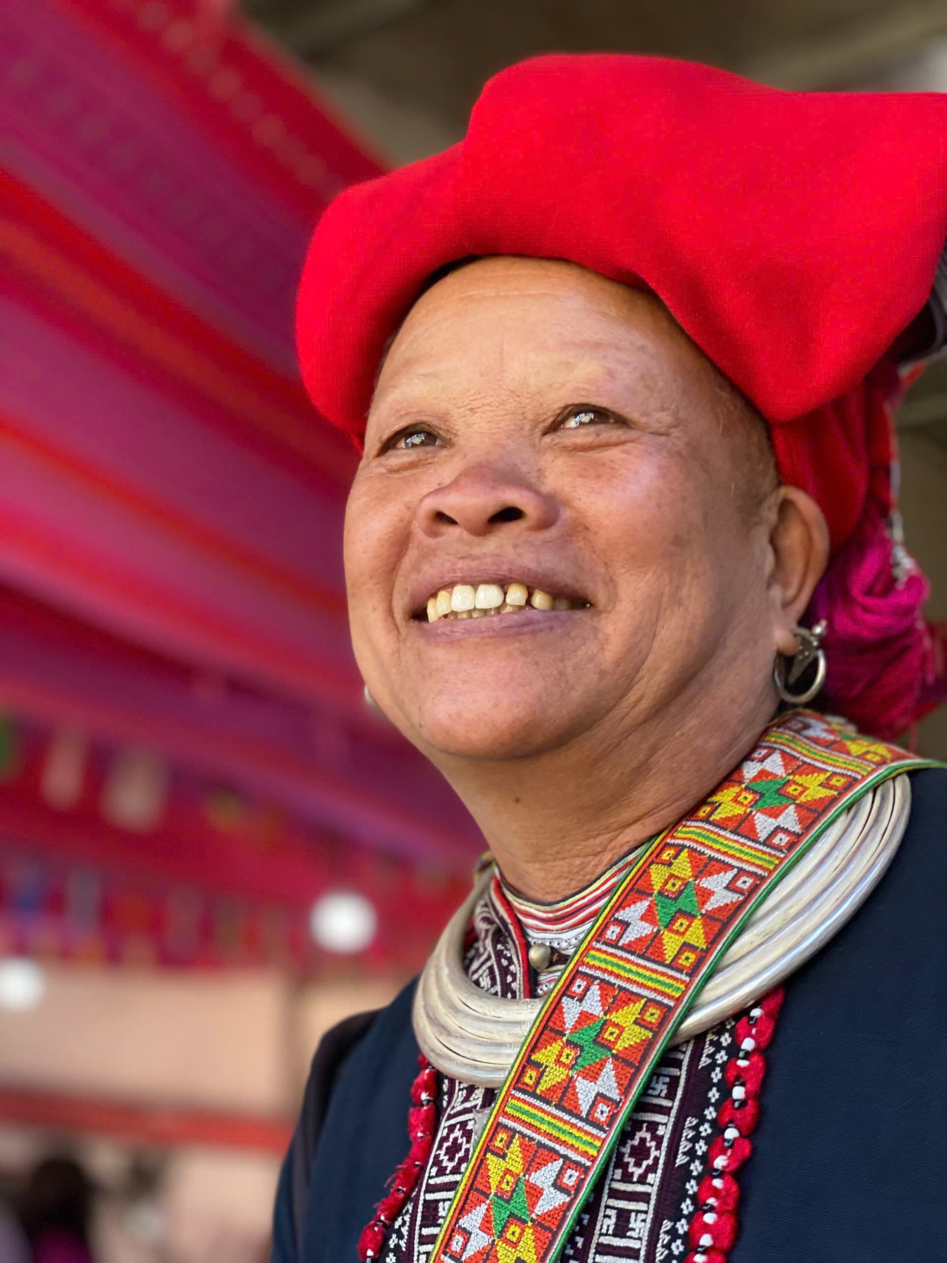 Red Dao woman wearing traditional embroidered clothing